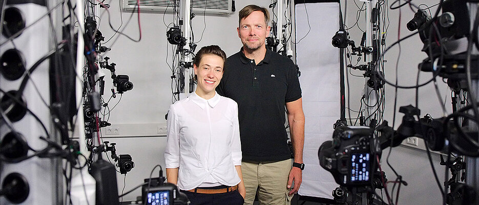 Marc Erich Latoschik and Carolin Wienrich in the lab where 120 cameras take multiple shots of a person to create an authentic avatar.